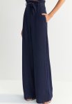 X Zeynep Tosun Belted Glittery Knitted Pants - Navy Blue