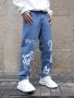 Fashionable Design Men's Graffiti Style Pattern Ripped Denim Jeans Stylish And Trendy Cotton Blend Pants For Street Leisurewear