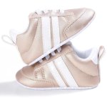 Gold Sneakers With White Stripes