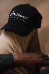 The Script Curved Peak Snap Back Cap In Monochrome