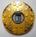 Parts Ninjago Turntable 6 X 6 X 1 1 3 Round Base With Pearl Gold Top With Gold Faces On Reddish Brown Pattern Ninjago Spinner