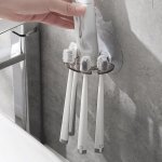 Wall Mounted Toothbrush Holder Plastic Toothpaste Storage Rack No Drilling Required Bathroom Organizer Toothbrush Stand Non-elec