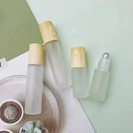 1PC Roller Bottle With Wood Grain Lid Essential Oil Perfume Roll On Bottle Compact And Portable Frosted Glass Bottle With Roller