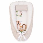 A Beige Woodlands Leaf And Tree Print Baby Nest Pod Newborn Lounger